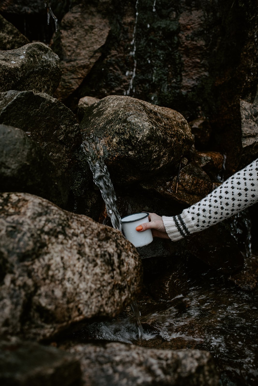Collecting water from a mountain stream in Lysefjorden.
